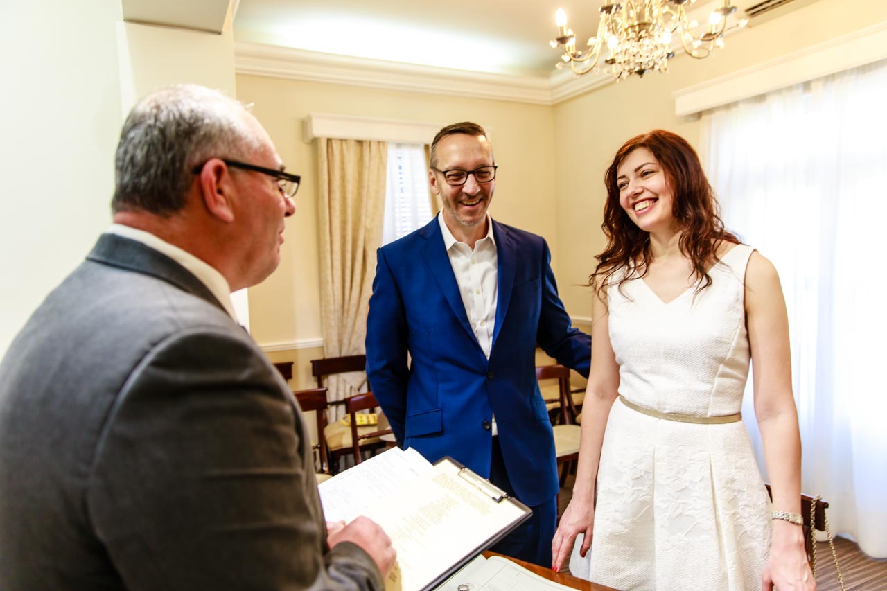 Registry Office Wedding Gibraltar Photographer 5 Couple reciting Inside the Gibraltar Registry Office wedding vows