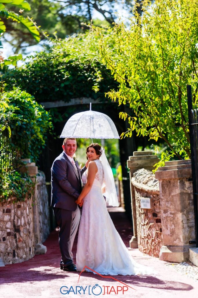 The Botanical Gardens Gibraltar Wedding bride and groom with umbrella