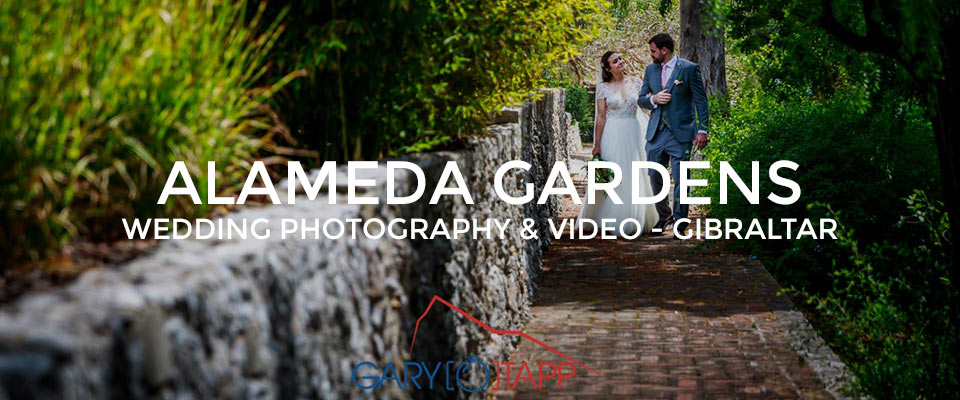 Bride and Groom walking through the Alameda Gardens Gibraltar weddings area