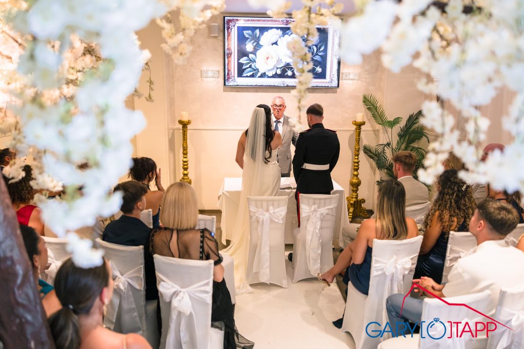 The Lounge Bar Gibraltar Wedding Photographer 3 Down the ceremony aisle at the Lounge Bar Gibraltar wedding venue
